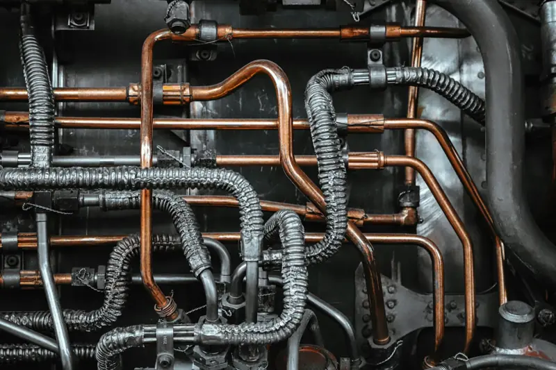 Copper and braided hydraulic lines on machinery