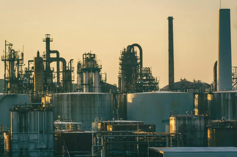 Refinery columns and storage tanks at dusk